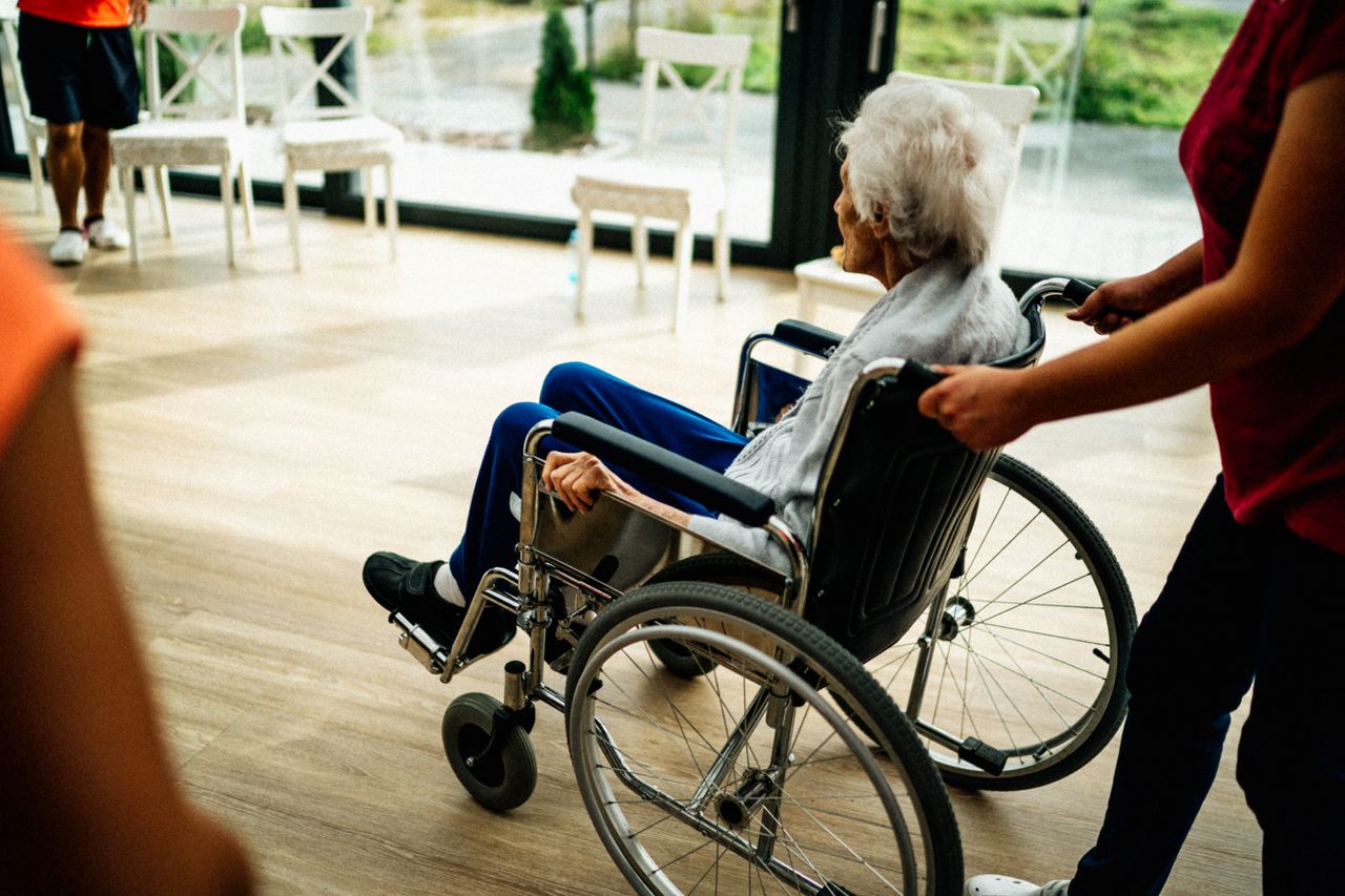 Services A caregiver assists a senior adult in a wheelchair at a nursing home in Prague, Czech Republic.
