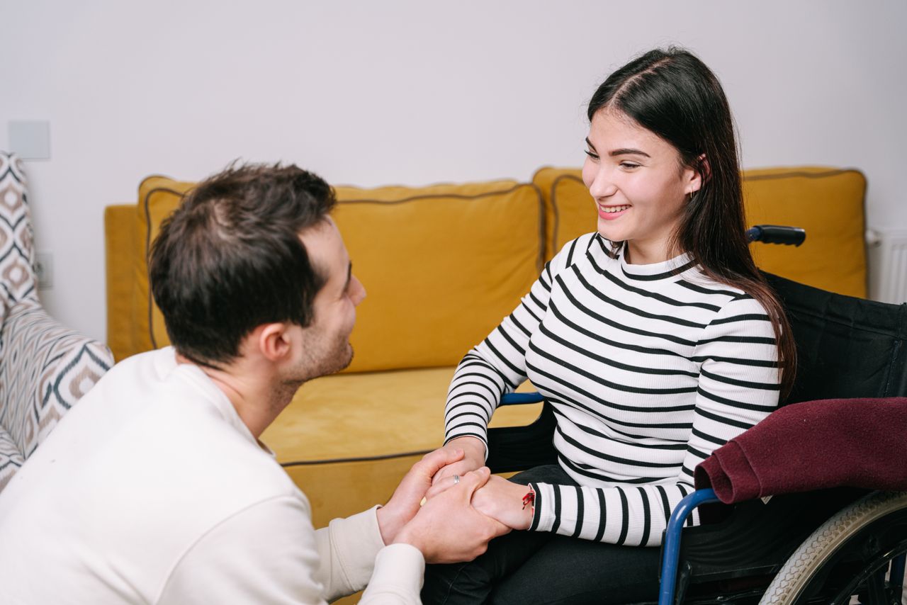 Services Happy couple sharing a warm moment of care and comfort indoors.